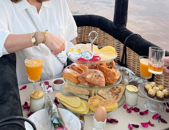 Private hot air balloon ride at sunrise with royal breakfast on board