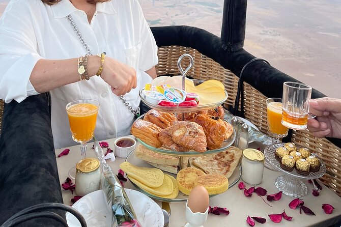 Private hot air balloon ride at sunrise with royal breakfast on board